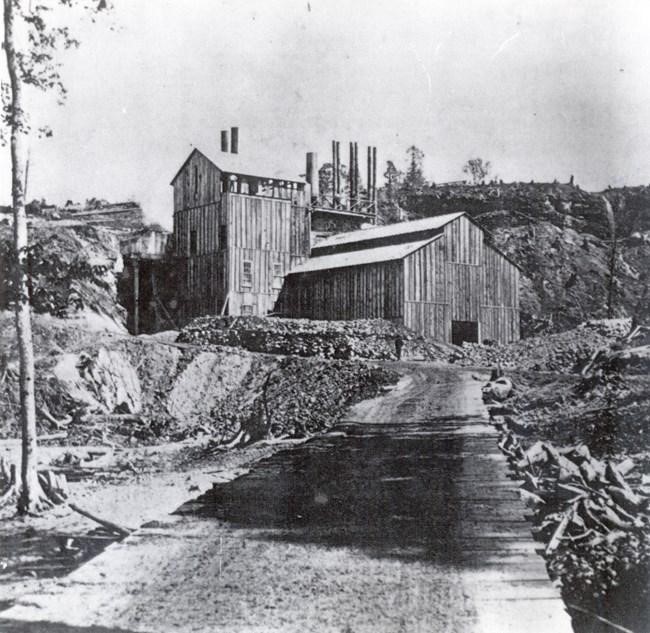 The Schoolcraft Blast Furnace, now where Munising Falls in the Pictured Rocks National Lakeshore is located, is pictured. Photo courtesy of the National Park Service.