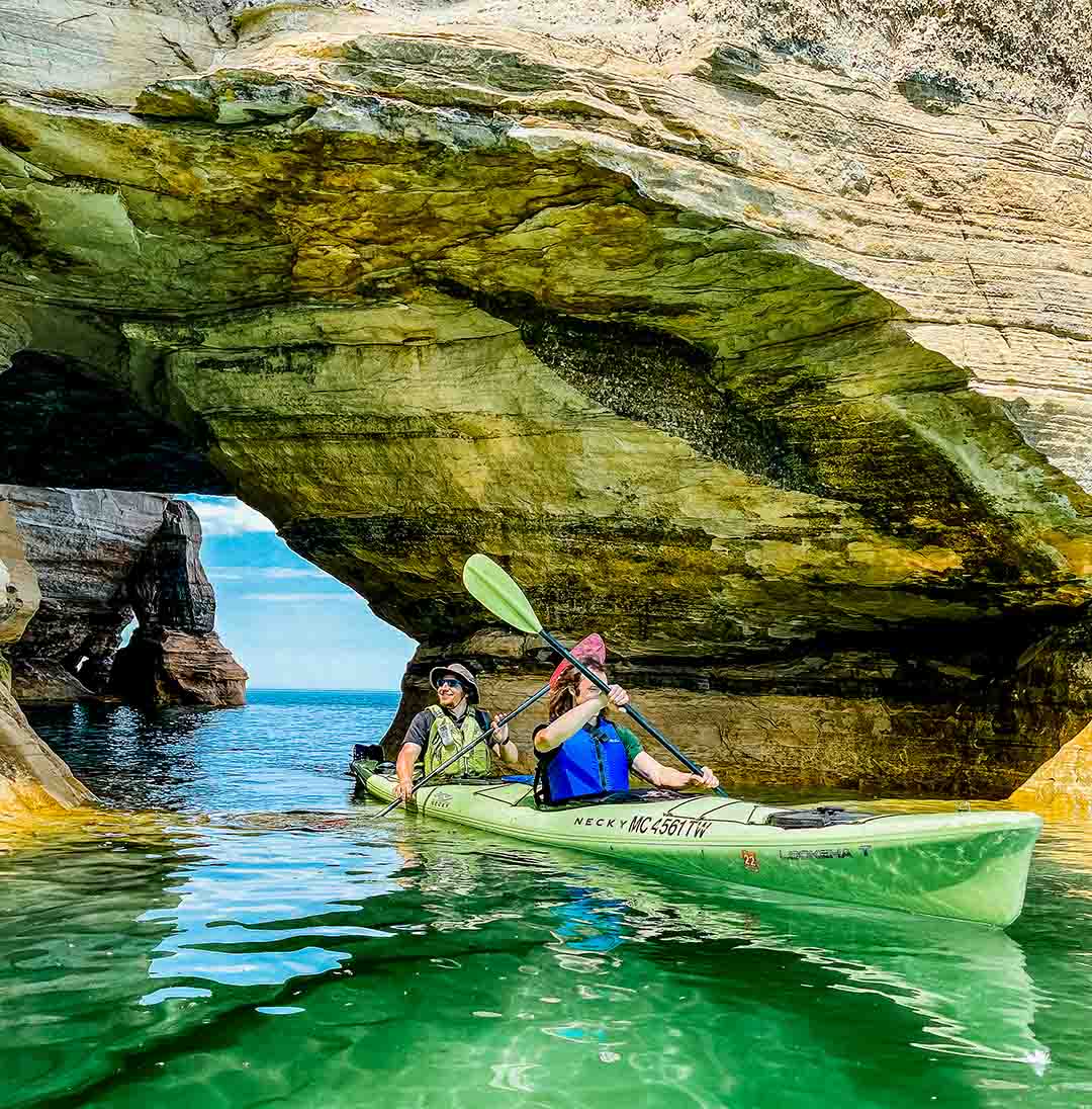 Paddlers get so close they can touch the Pictured Rocks. PC: Pictured Rocks Kayaking.