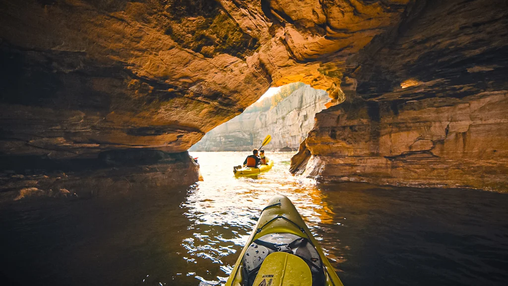 Kayaking through a sea cave in Pictured Rocks National Lakeshore