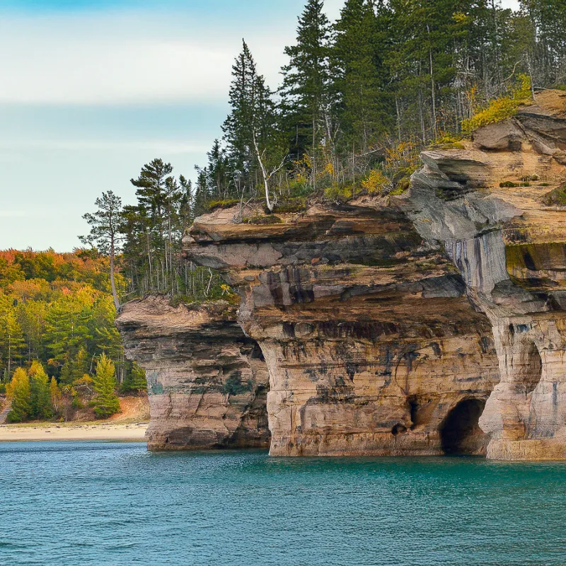 Battleship Rocks: Rock formations resembling ships, a unique sight on Pictured Rocks cruises.