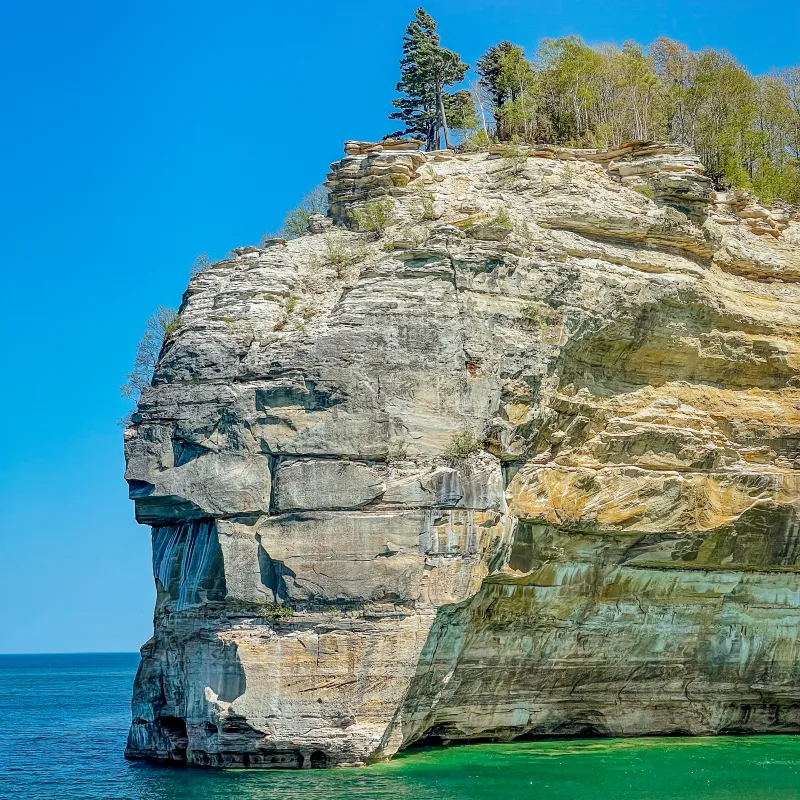 Indian Head: Giant cliff face shaped like a profile, a distinctive feature of Pictured Rocks cruises.