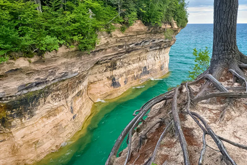 Pictured Rocks Cruise: Explore Chapel Cove, a scenic cove with dramatic sandstone cliffs, perfect for photography and unforgettable memories.