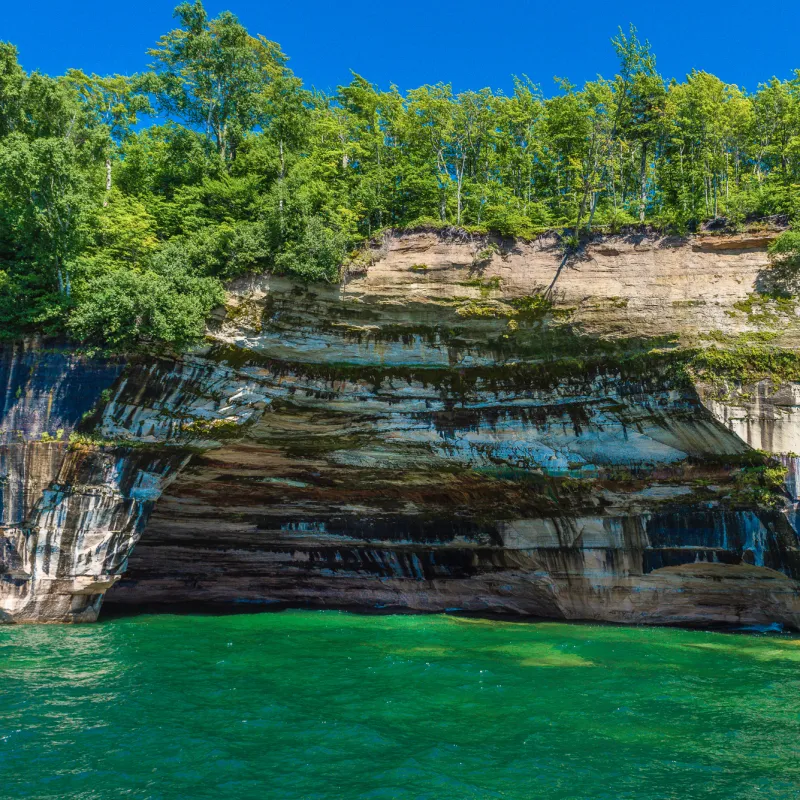 Rainbow Cave: Multicolored cave walls, a stunning visual highlight of Pictured Rocks boat tours.