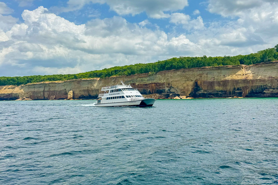 Pictured Rocks Cruises boat tour passing the sandstone cliffs of Pictured Rocks National Lakeshore