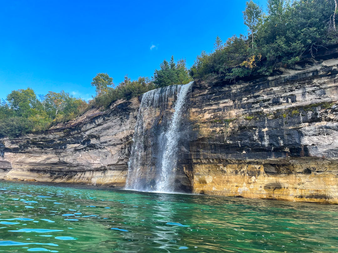 Spray Falls waterfall dropping 70 feet into Lake Superior on the Pictured Rocks Spray Falls Cruise