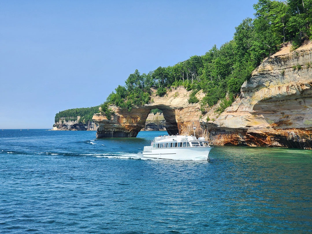 Pictured Rocks Cruises boat Miners Castle passing the Lovers Leap arch on Lake Superior